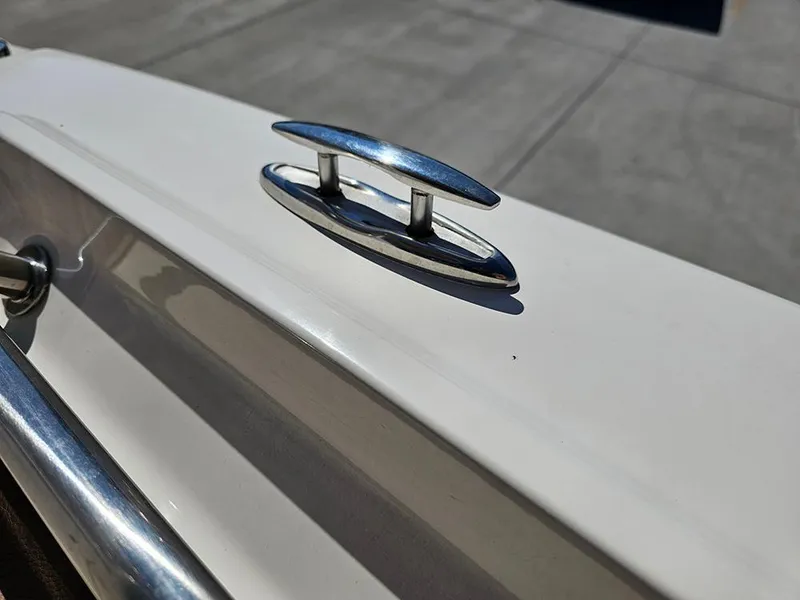 Slide: The Image of 2023 Pioneer 202 Islander boat cleat on white deck, close-up view. - 21