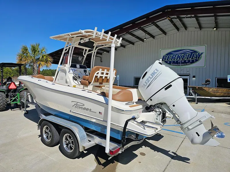 Slide: The Image of 2023 Pioneer 202 Islander boat on trailer, displayed outdoors near Berkeley building. - 3