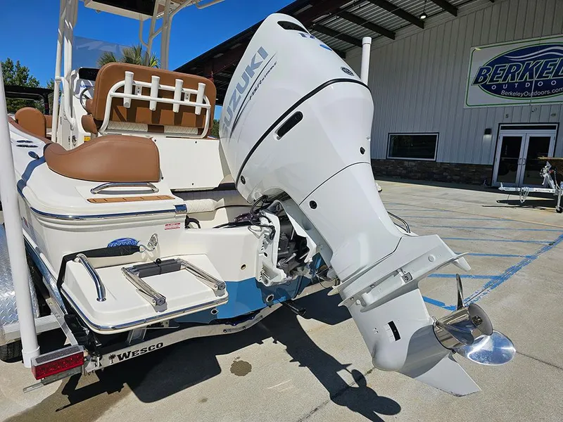 Slide: The Image of 2023 Pioneer 202 Islander boat with Suzuki outboard motor, parked at Berkeley Outdoors. - 9