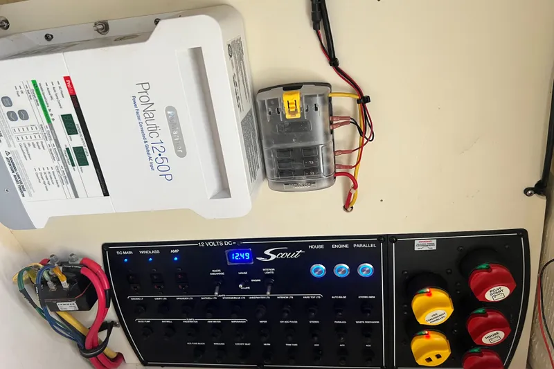 Slide: The Image of Electrical panel and ProNautic charger in a 2018 Scout 255 Dorado boat. - 24