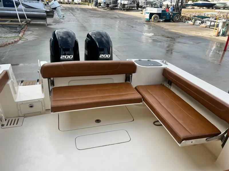 Slide: The Image of 2018 Scout 255 Dorado boat with twin 200 engines and brown seating. - 6