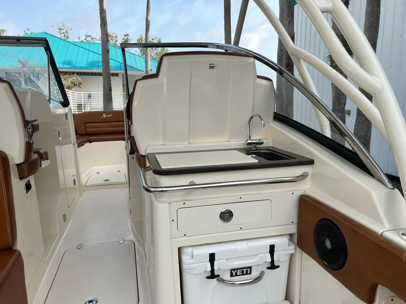 Slide: The Image of 2018 Scout 255 Dorado boat interior with sink and Yeti cooler. - 9