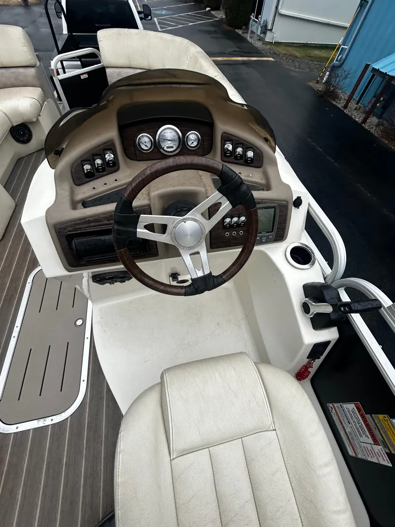 Slide: The Image of 2015 Bennington 2250 GSR boat dashboard with steering wheel and control panel. - 5