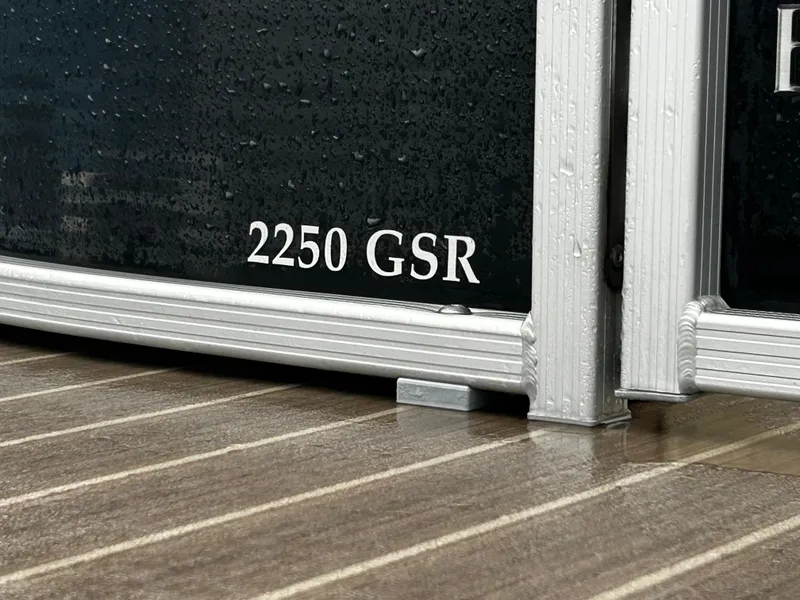 Slide: The Image of Close-up of 2015 Bennington 2250 GSR model name on a wet surface. - 7