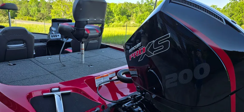 Slide: The Image of 2025 Nitro Z19 boat with Mercury Pro XS 200 engine, red and black design. - 7