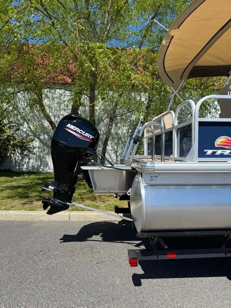 Slide: The Image of 2025 Sun Tracker Bass Buggy 16 XL Select pontoon boat with Mercury outboard motor. - 6