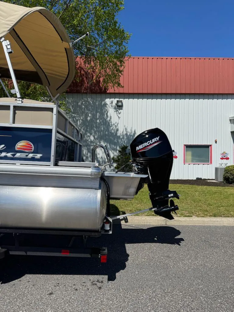 Slide: The Image of 2025 Sun Tracker Bass Buggy 16 XL Select pontoon boat with Mercury outboard motor. - 7