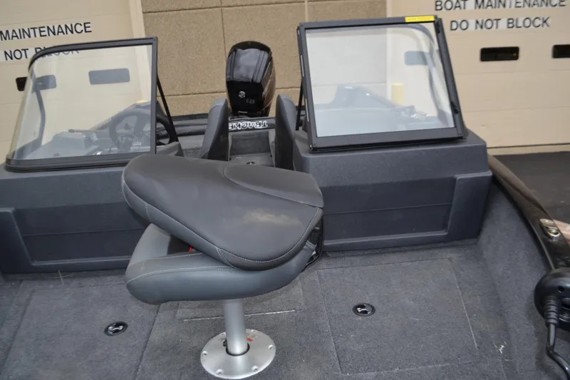 Slide: The Image of 2025 Tracker Pro Guide V-175 Combo boat interior with seating and windshield. - 3
