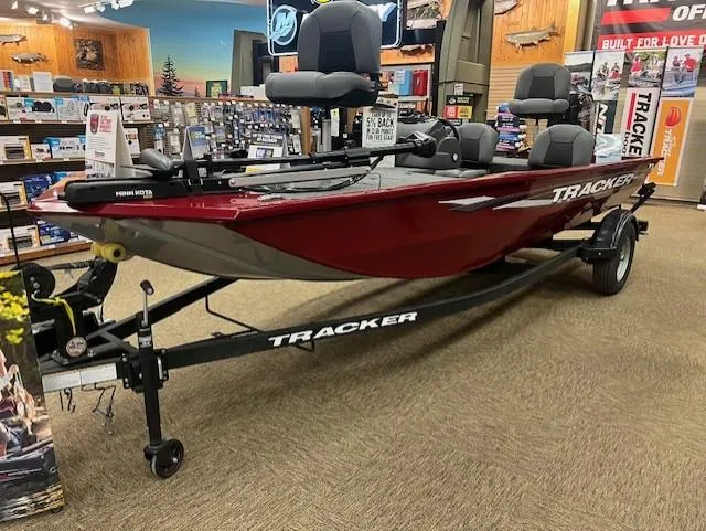 The Image of 2025 Tracker Pro 170 boat displayed in a showroom, featuring a sleek red design. - 0