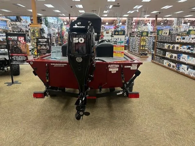 Slide: The Image of 2025 Tracker Pro 170 boat displayed indoors with a Mercury 50 outboard motor. - 3