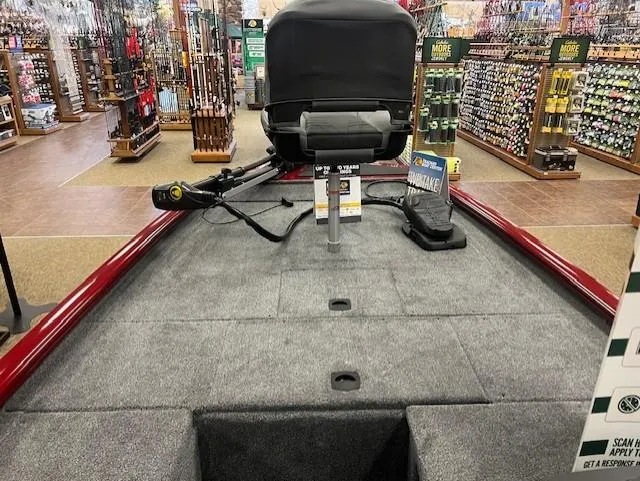 Slide: The Image of 2025 Tracker Pro 170 boat interior in a store, featuring fishing equipment and accessories. - 5