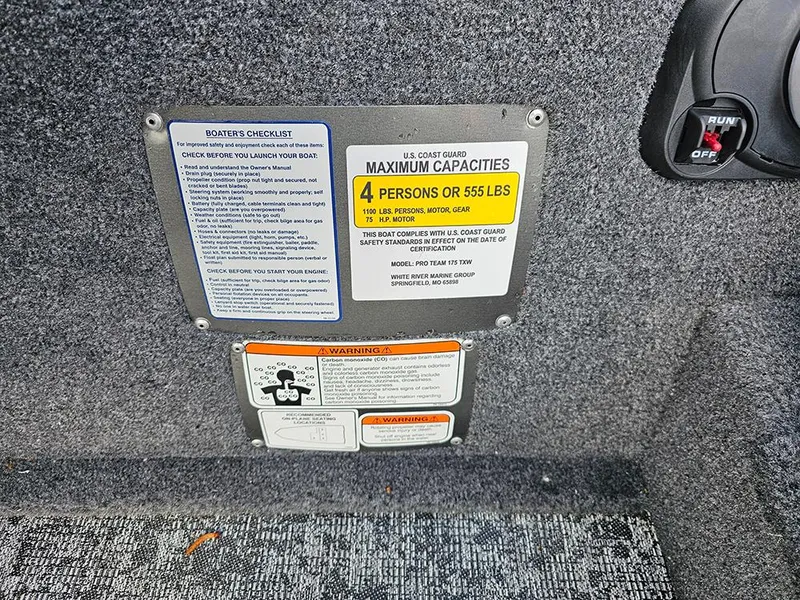 Slide: The Image of 2025 Tracker Pro Team 175 capacity and safety labels, showing maximum capacity of 4 persons or 555 lbs. - 12