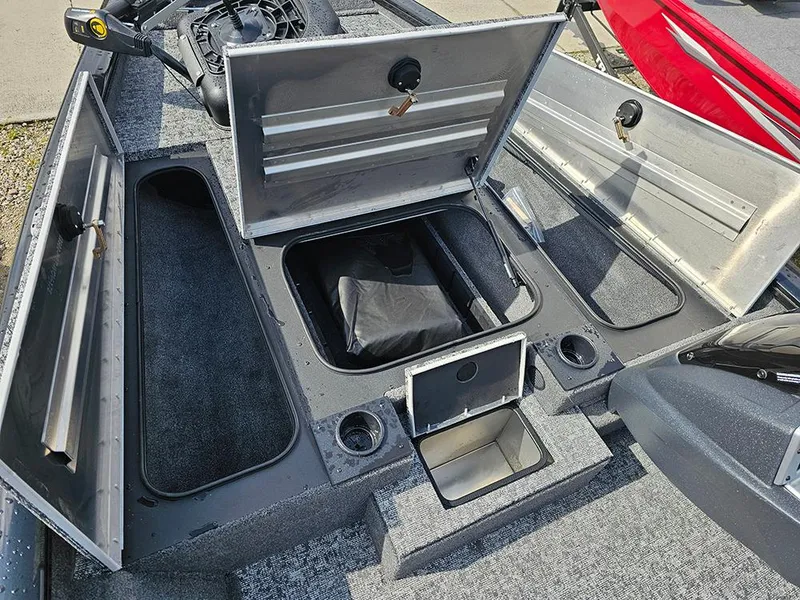 Slide: The Image of 2025 Tracker Pro Team 175 boat interior with open storage compartments and seating area. - 15