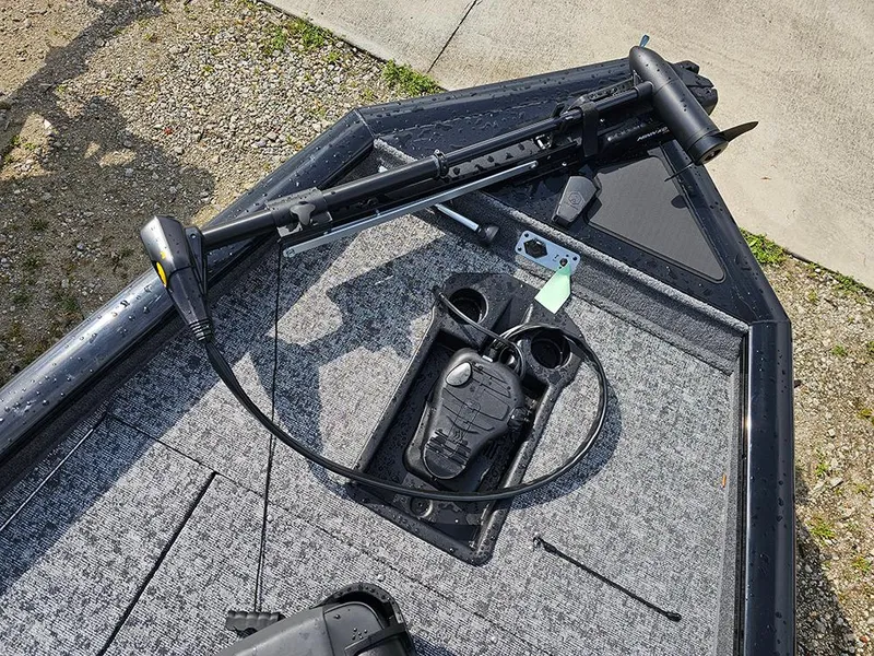 Slide: The Image of 2025 Tracker Pro Team 175 boat deck with trolling motor and foot pedal. - 16