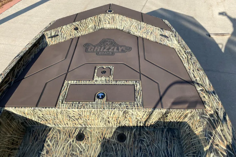 Slide: The Image of 2025 Tracker Grizzly 1860 CC boat with camouflage design on deck. - 3