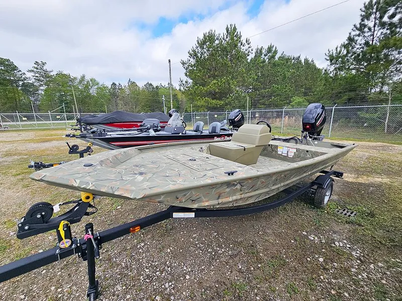 Slide: The Image of 2025 Tracker Grizzly 1648 SC boat on trailer, parked outdoors. - 2