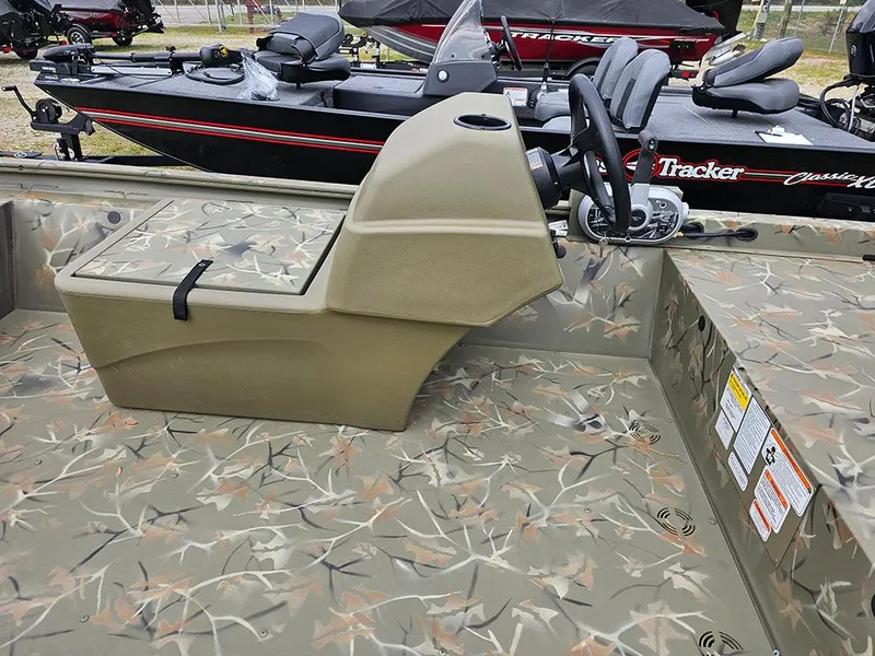 Slide: The Image of 2025 Tracker Grizzly 1648 SC boat with camouflage interior and steering console. - 7