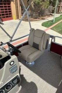 Slide: The Image of 2025 Sun Tracker Bass Buggy 16 XL Select boat interior with beige captain's chair. - 6