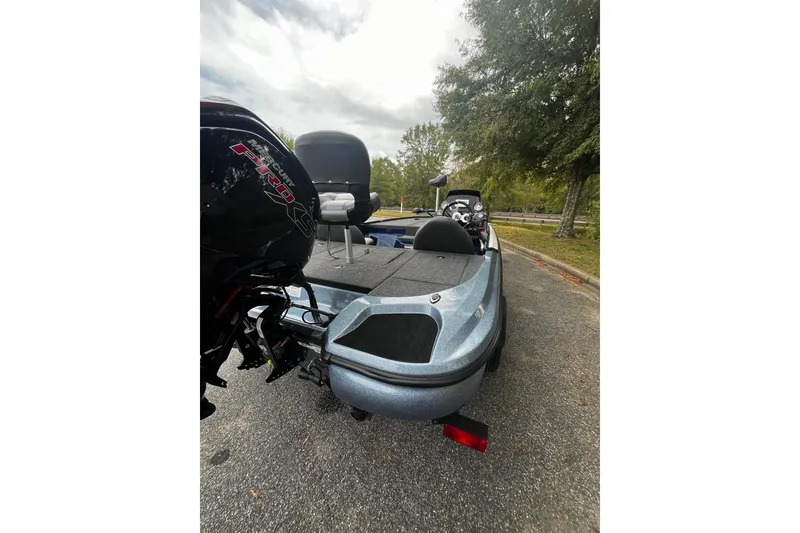 Slide: The Image of 2025 Nitro Z17 boat with Mercury Pro XS engine, parked on a road. - 3