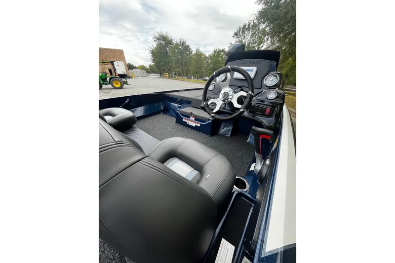 Slide: The Image of Interior of 2025 Nitro Z17 boat featuring steering wheel and dashboard controls. - 7