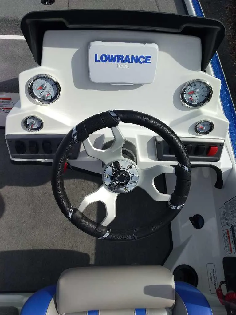 Slide: The Image of Steering console of 2025 Nitro Z18 boat with Lowrance display and gauges. - 2
