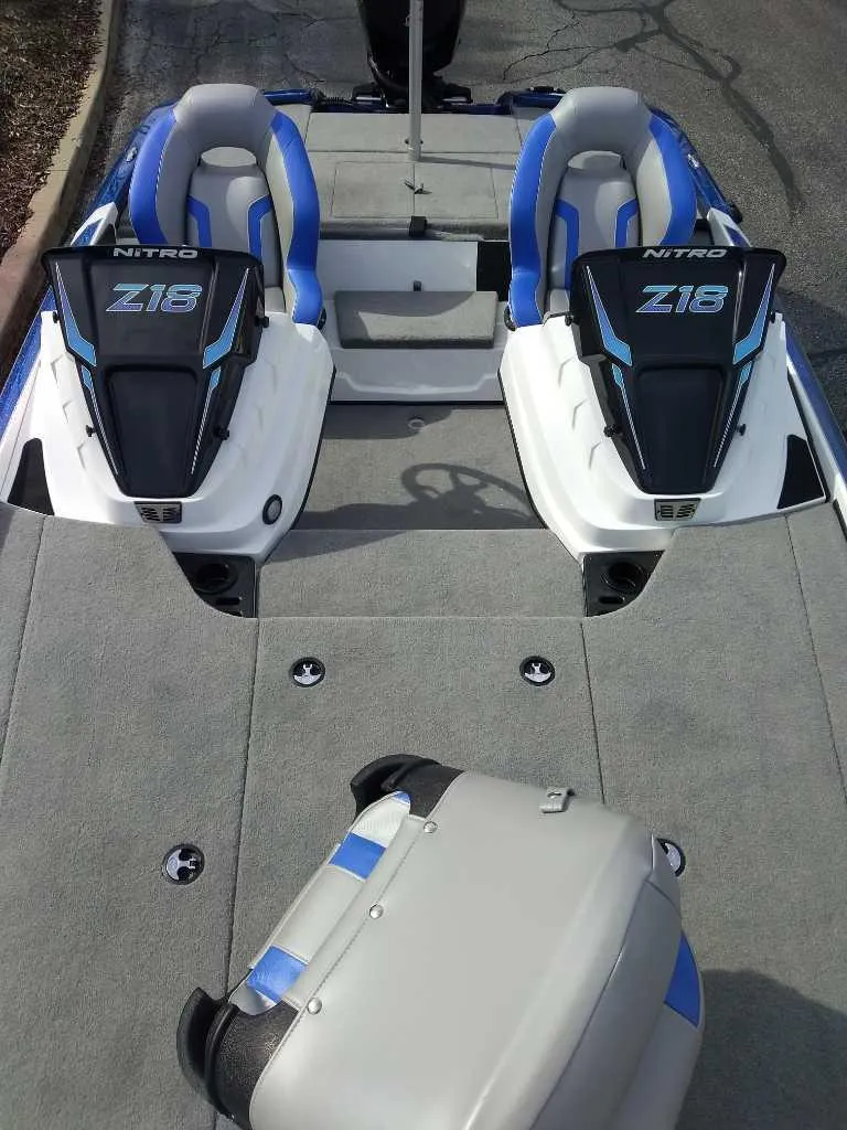 Slide: The Image of 2025 Nitro Z18 boat interior with dual seats and sleek design. - 4