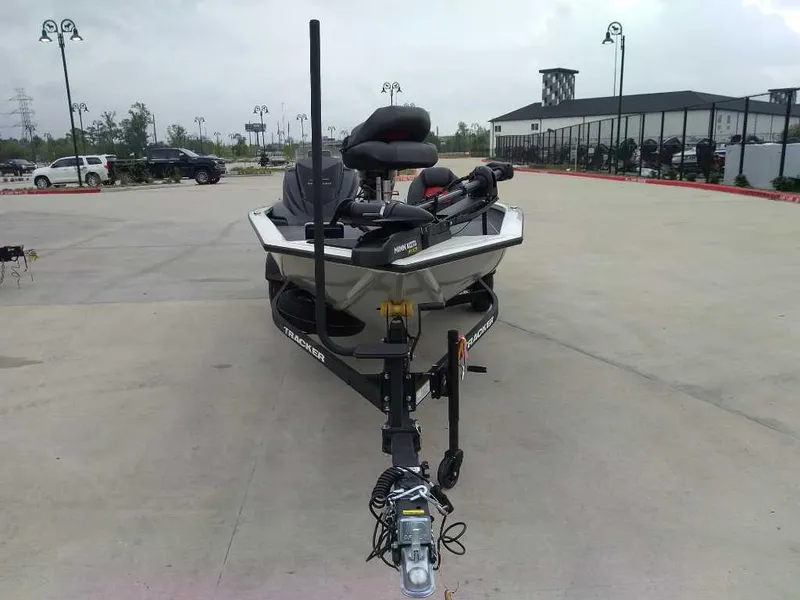 Slide: The Image of 2025 Tracker Pro Team 175 boat on trailer in parking lot. - 2
