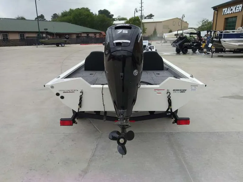 Slide: The Image of 2025 Tracker Pro Team 175 boat with 75 HP engine, parked outdoors. - 3