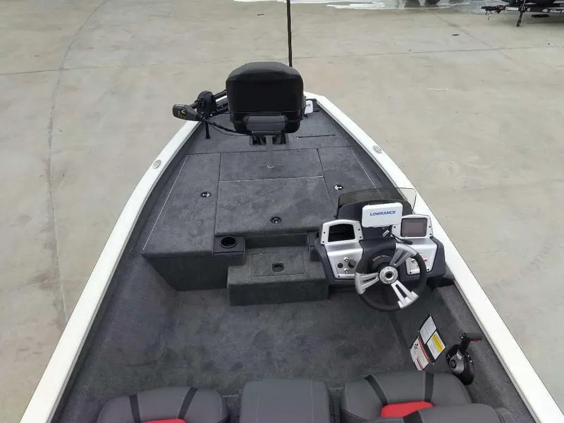 Slide: The Image of 2025 Tracker Pro Team 175 boat interior with steering console and seating. - 4