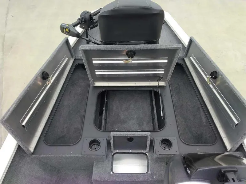Slide: The Image of 2025 Tracker Pro Team 175 boat interior with open storage compartments. - 5