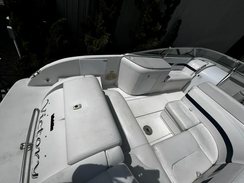 Slide: The Image of 2000 Formula 260 Sun Sport boat interior with white seating and sleek design. - 10