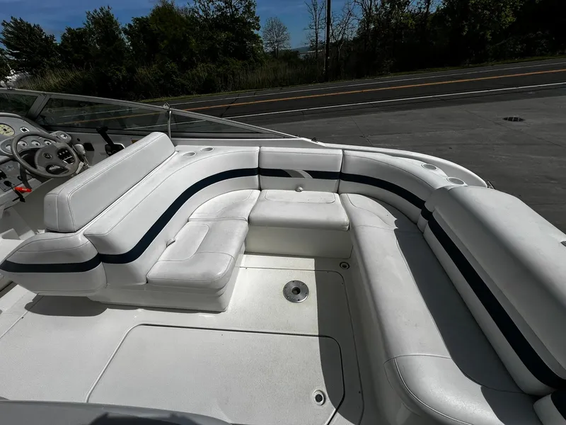Slide: The Image of 2000 Formula 260 Sun Sport boat with white seating and black accents. - 11
