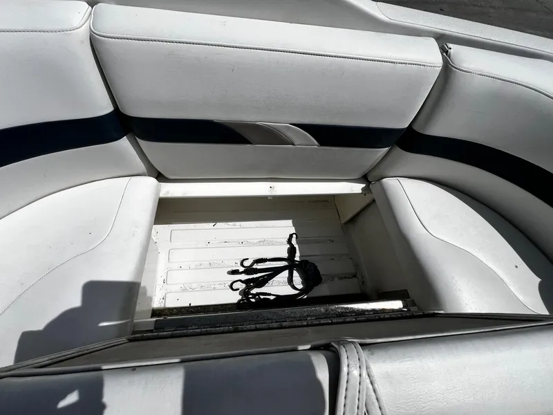 Slide: The Image of Interior seating of 2000 Formula 260 Sun Sport boat with storage compartment. - 13