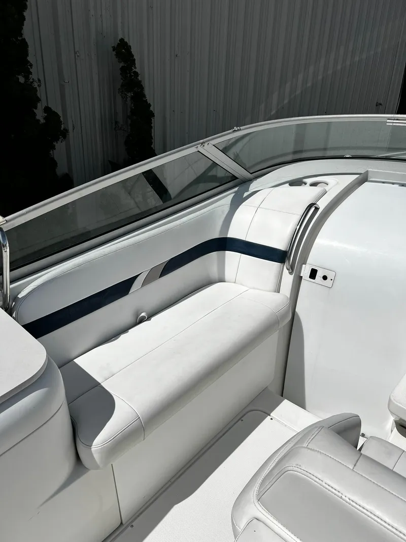 Slide: The Image of 2000 Formula 260 Sun Sport boat interior with white seating and sleek design. - 18