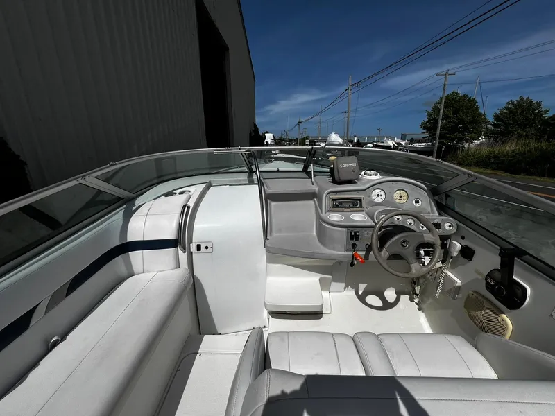 Slide: The Image of 2000 Formula 260 Sun Sport boat interior with steering wheel and seating. - 19
