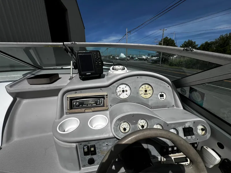Slide: The Image of Dashboard of a 2000 Formula 260 Sun Sport boat with gauges and controls. - 21