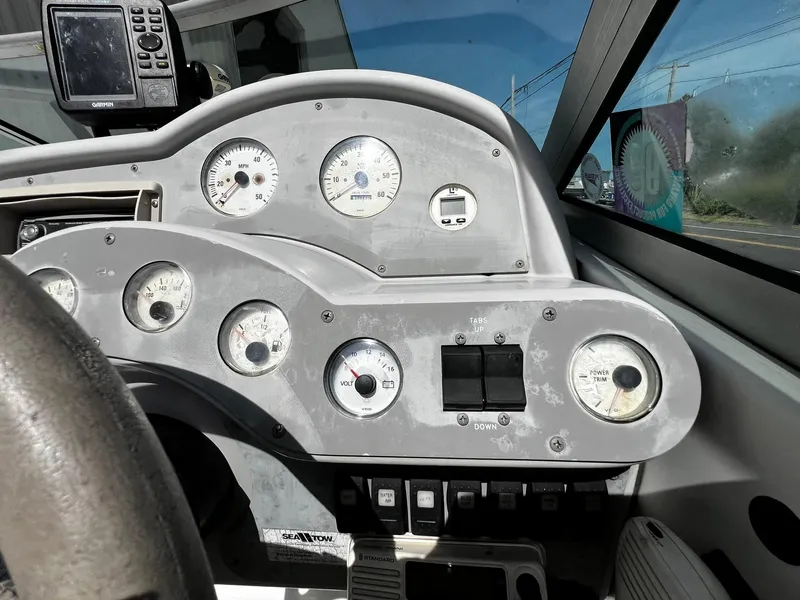 Slide: The Image of Dashboard of a 2000 Formula 260 Sun Sport boat with gauges and controls. - 22