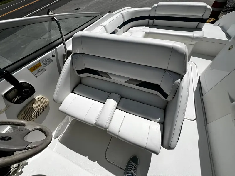 Slide: The Image of Interior of 2000 Formula 260 Sun Sport boat with white seating and steering wheel. - 24