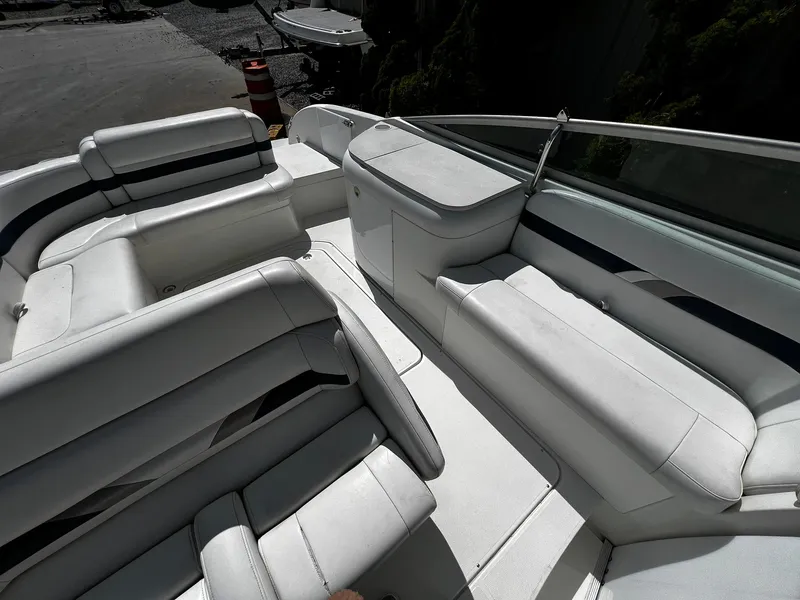 Slide: The Image of 2000 Formula 260 Sun Sport boat interior with white seating and sleek design. - 25