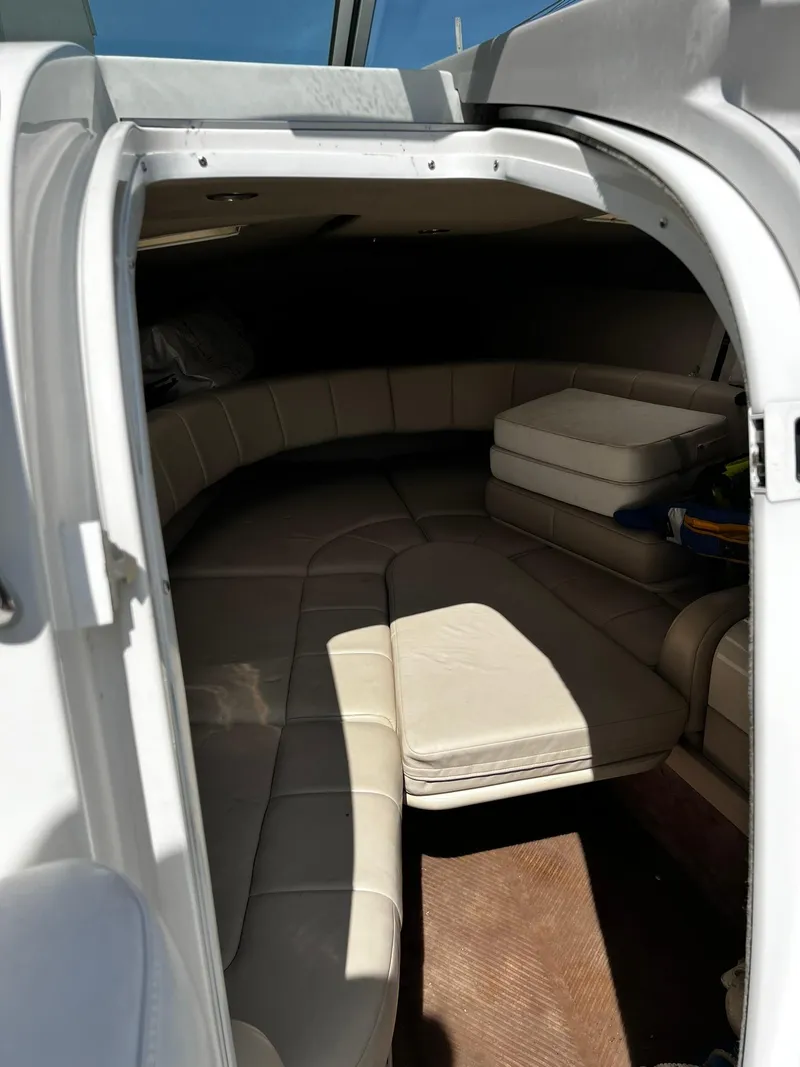 Slide: The Image of Interior cabin of a 2000 Formula 260 Sun Sport boat with beige seating. - 26