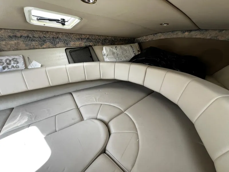 Slide: The Image of Interior cabin of 2000 Formula 260 Sun Sport boat with cushioned seating. - 27