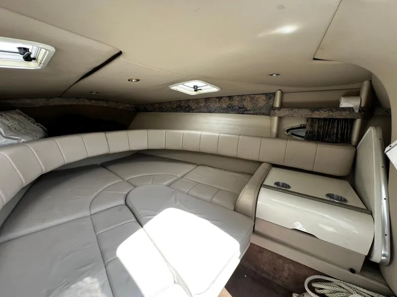 Slide: The Image of Interior cabin of 2000 Formula 260 Sun Sport boat with cushioned seating. - 28
