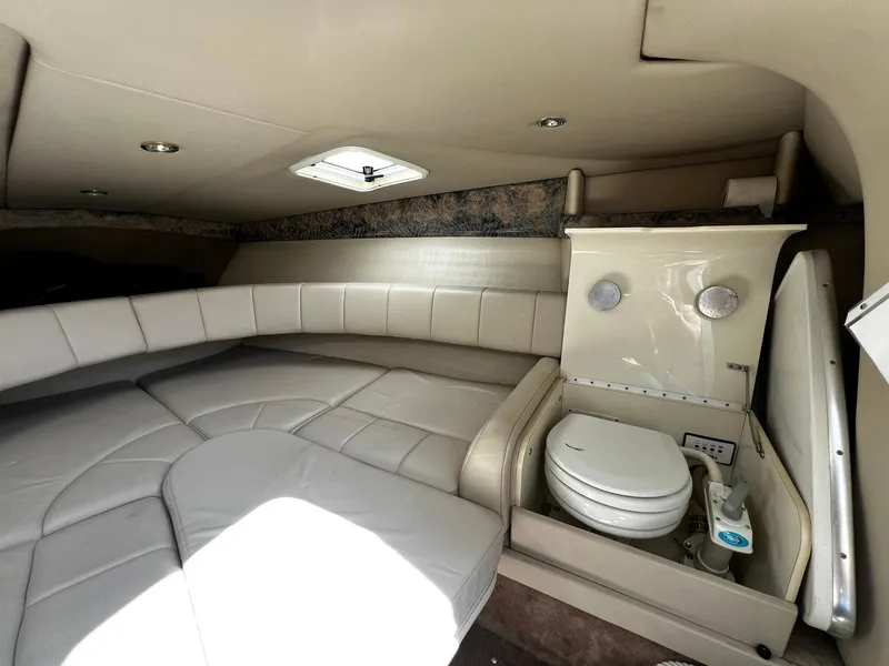 Slide: The Image of Interior of 2000 Formula 260 Sun Sport boat with seating and compact toilet. - 29