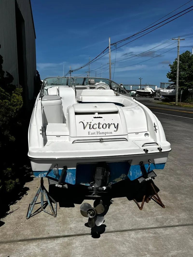 Slide: The Image of 2000 Formula 260 Sun Sport boat named "Victory" in East Hampton, docked on land. - 4