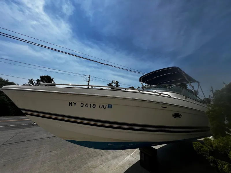 Slide: The Image of 2000 Formula 260 Sun Sport boat on display under a clear blue sky. - 7