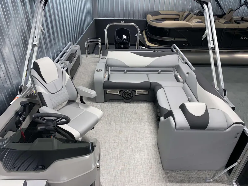 Slide: The Image of 2025 Avalon LSZ 2385 VRB Tritoon interior with modern seating and steering console. - 10