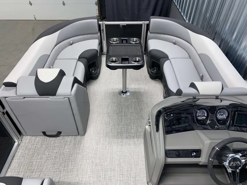 Slide: The Image of 2025 Avalon LSZ 2385 VRB Tritoon interior with plush seating and modern dashboard. - 11