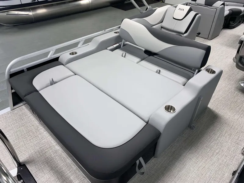Slide: The Image of 2025 Avalon LSZ 2385 VRB Tritoon interior with luxurious gray seating and cup holders. - 3