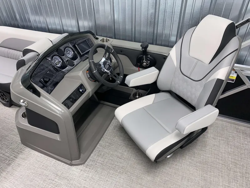 Slide: The Image of Captain's chair and helm of 2025 Avalon LSZ 2385 VRB Tritoon boat. - 6