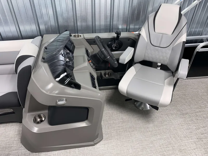 Slide: The Image of 2025 Avalon LSZ 2385 VRB Tritoon helm with modern steering and comfortable captain's chair. - 7